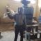Chairperson for Hara Rice Cooperative Mr. Msomphola explaining how the rice processing machine operates